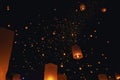 The beauty of the lanterns floating in the sky during the Yi Peng Festival and the Floating Lantern Festival in Chiang Mai Royalty Free Stock Photo