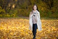 Beauty little girl walking in autumn park Royalty Free Stock Photo