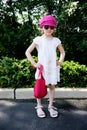 Beauty little girl in white dress posing ourdoors