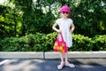 Beauty little girl in white dress posing ourdoors