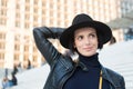 Beauty, look, makeup. Woman in black hat smile on stairs in paris, france, fashion. Fashion, accessory, style. Sensual woman with