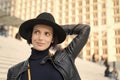 Beauty, look, makeup. Woman in black hat smile on stairs in paris, france, fashion. Fashion, accessory, style. Sensual Royalty Free Stock Photo