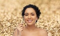 smiling african american woman with mascara brush Royalty Free Stock Photo