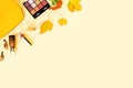 Beauty make up products and cosmetics set on autumn yellow leaves background. Royalty Free Stock Photo