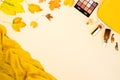 Beauty make up products and cosmetics set on autumn yellow leaves background. Royalty Free Stock Photo