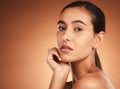 Beauty, makeup and face portrait of woman on brown studio background. Wellness, aesthetic and skincare routine of young Royalty Free Stock Photo