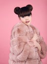 Beauty makeup. Fashion teen girl model in fur coat. Brunette wit Royalty Free Stock Photo