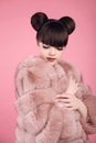 Beauty makeup. Fashion teen girl model in fur coat. Brunette wit Royalty Free Stock Photo