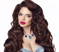 Beauty makeup, wavy hairstyle, fashion jewelry. Brunette young w