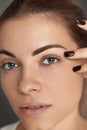 Beauty makeup. Woman face with beautiful eyes and eyebrows make-up and long black eyelashes Royalty Free Stock Photo