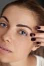 Beauty makeup. Woman face with beautiful eyes and eyebrows make-up and long black eyelashes closeup. Royalty Free Stock Photo