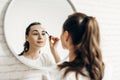 Beauty makeup woman putting mascara eye make up Royalty Free Stock Photo