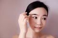 Beauty makeup woman putting mascara eye make up Royalty Free Stock Photo