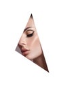 Beauty makeup women, eye brows eyelashes and lips in a triangular hole paper white background. Professional beauty makeup, place