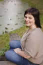 Beauty mature brunette woman in park happy smiling close up autumn park thinking, lifestyle people concept Royalty Free Stock Photo