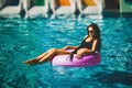 Beauty model in bikini in the swimming pool Royalty Free Stock Photo