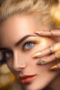 Beauty model girl with golden makeup Royalty Free Stock Photo