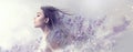 Beauty model girl with lavender flowers. Beautiful young brunette woman with flying long hair profile portrait Royalty Free Stock Photo