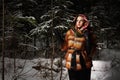 Beauty model girl in night winter forest. beautiful young Woman in fashionable Fur Coat and scarf Royalty Free Stock Photo