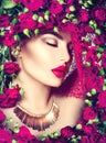 Beauty model girl with pink roses flower wreath and fashion makeup Royalty Free Stock Photo