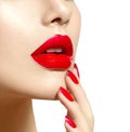 Beauty model girl with red lips and nails closeup Royalty Free Stock Photo