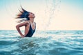 Beauty Model Girl Splashing Water with her Hair. A young woman i Royalty Free Stock Photo