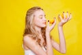 Beauty Model Girl takes Juicy Oranges Royalty Free Stock Photo