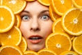Face of a beautiful girl in orange slices Royalty Free Stock Photo