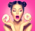 Beauty model girl taking colorful donuts Royalty Free Stock Photo