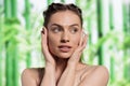 Beauty model holding palms on face, demonstrating fresh skin Royalty Free Stock Photo