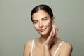 Beauty Model with Perfect Fresh Skin applying Face Cream. Spa and Wellness. Youth and Skin Care Concept Royalty Free Stock Photo