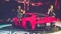 Beauty Model and Red Chevrolet Corvette car on display at Vietnam motor Show 2017