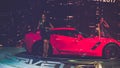 Beauty Model and Red Chevrolet Corvette car on display at Vietnam motor Show 2017