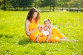 Beauty Mom and baby outdoors. Happy family playing in nature. Mo Royalty Free Stock Photo