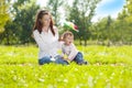 Beauty Mom and baby outdoors. Happy family playing in nature. Mo Royalty Free Stock Photo