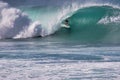 Unrecognizable surfer encapsulated in the center of a wave. ave