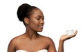 Smiling african american woman with moisturizer