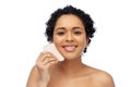 happy woman massaging her face with gua sha tool