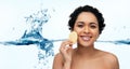 young woman cleaning face with exfoliating sponge Royalty Free Stock Photo