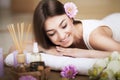 Woman at the spa. Healthy lifestyle and relaxation concept. A beautiful young woman on a massage table. Aroma oil and butter. Spa Royalty Free Stock Photo