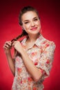 Beauty photo of an Caucasian model on red background
