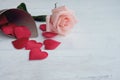 Beauty pink-orange rose and red satin hearts shape on wooden floor. Valentine& x27;s day background concept Royalty Free Stock Photo