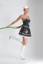 Beauty pinup girl in a sailor suit rope pulling Royalty Free Stock Photo