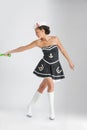 Beauty pinup girl in a sailor suit rope pulling Royalty Free Stock Photo