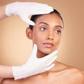 Beauty, plastic surgery and hands with face of Indian woman in studio for cosmetics, skincare and botox. Spa treatment Royalty Free Stock Photo