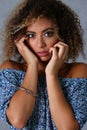 Beauty portrait of african american woman with clean healthy skin on beige background vertical photo Royalty Free Stock Photo