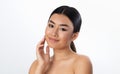 Attractive Asian Woman Touching Face Posing On White Studio Background Royalty Free Stock Photo