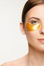 Beauty portrait of an attractive girl with a gold patch under the eye. Royalty Free Stock Photo