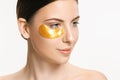 Beauty portrait of an attractive girl with a gold patch under the eye. Royalty Free Stock Photo