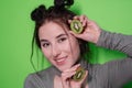 Beauty portrait of attractive young woman with clean radiant skin face with kiwi halves, brunette girl with bare Royalty Free Stock Photo